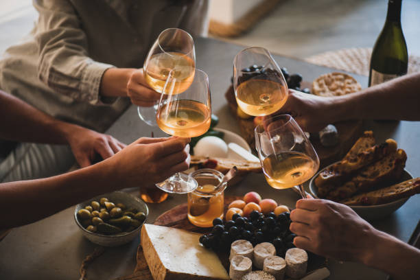 Friends having wine tasting and great food
