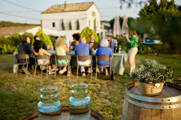 Wine tasting group at outdoor table having lunch