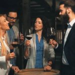 colleagues tasting wine together in a wine cellar